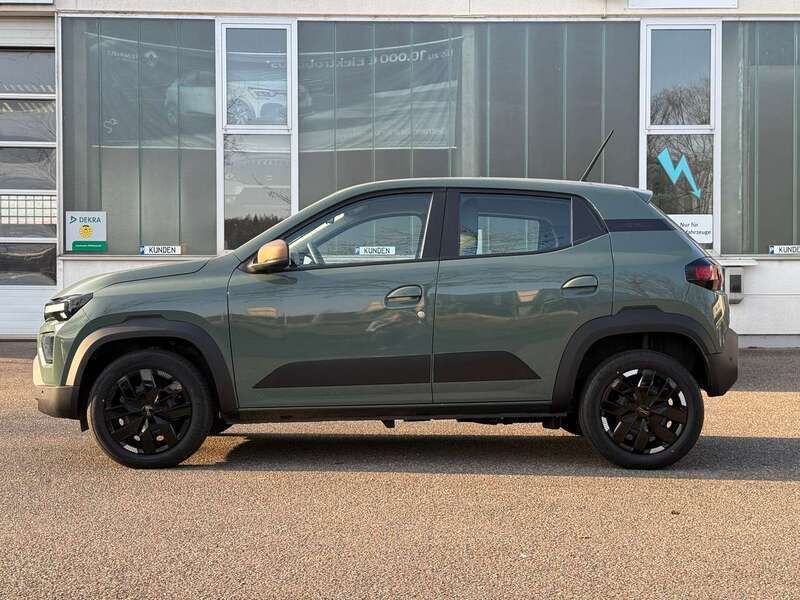 Gebraucht Dacia Spring Extreme 47 kW (65 PS) 2024 Oliv grün Kleinwagen