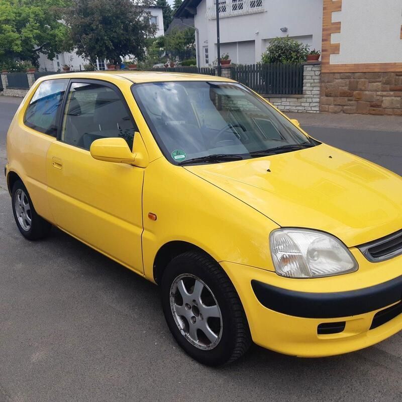 Gelb Gebraucht 1999 Honda Logo LS Kleinwagen | 750 € - Bild 1/4