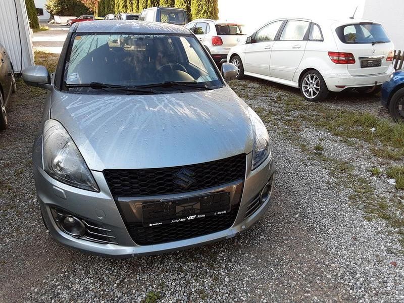 Grau Gebraucht 2015 Suzuki Swift Sport Limousine | 5.490 € (Guter Preis) - Bild 1/4