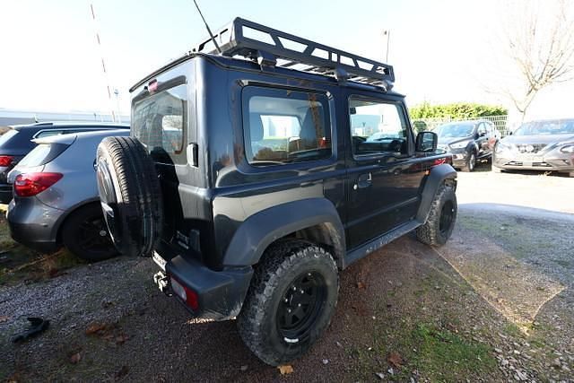 Bluish black pearl bluish black pearl Gebraucht 2019 Suzuki Jimny Comfort SUV | 28.336 € (Fairer Preis) - Bild 1/4