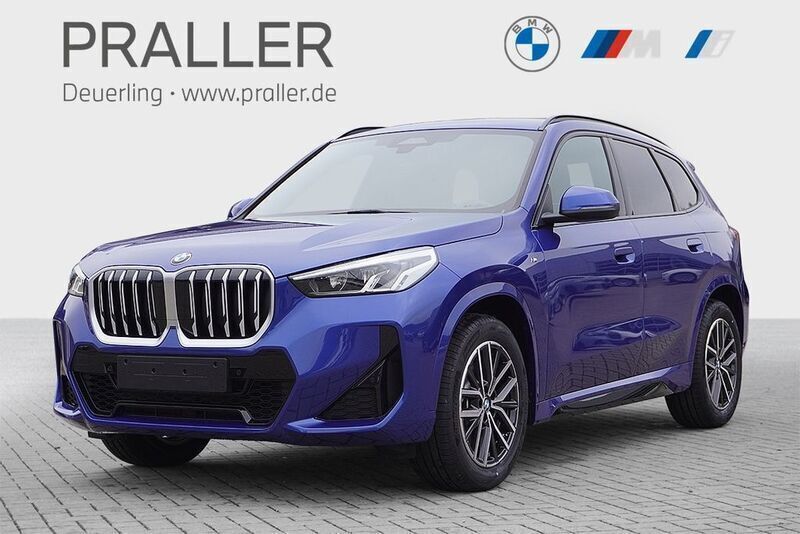 Portimao blau metallic Gebraucht 2024 BMW X1 M Sport SUV | 43.900 € (Teuer) - Bild 1/4