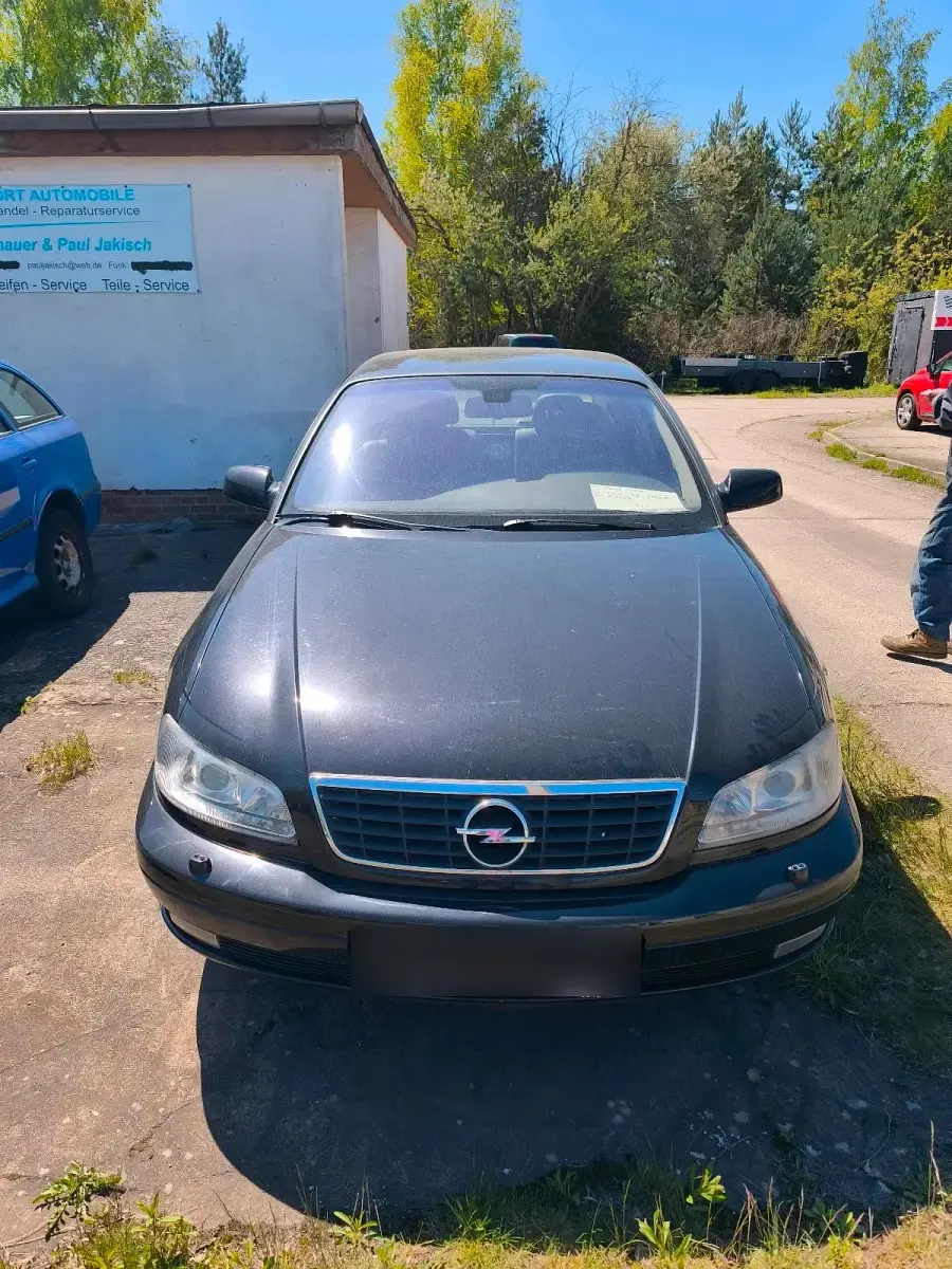 Second-hand Opel Omega 150 CP (110 kW) 2002 Negru Berlinǎ