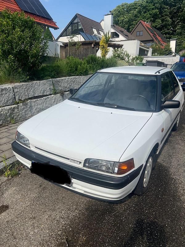 Weiß Gebraucht 1991 Mazda 323 Kleinwagen | 2.750 € - Bild 1/4
