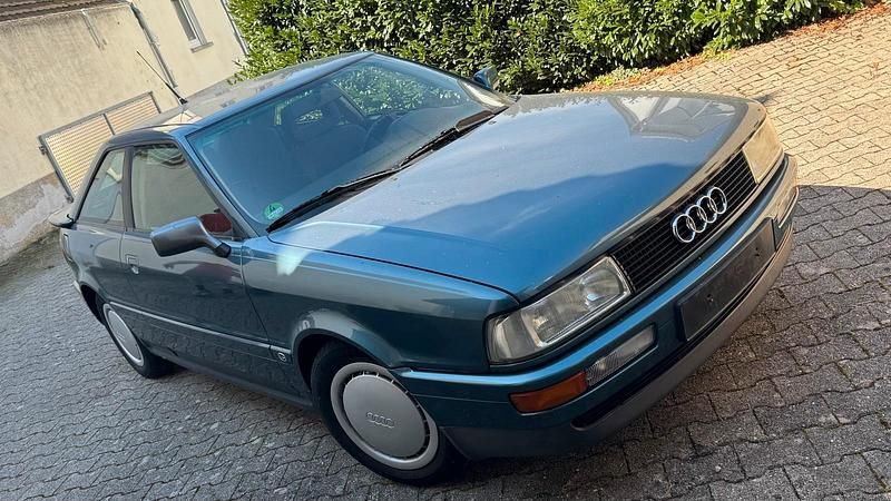 Grün Gebraucht 1990 Audi Coupé Coupé | 9.999 € - Bild 1/4