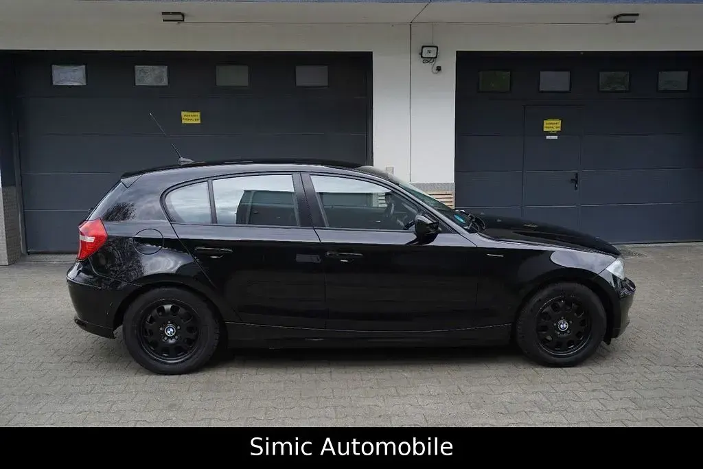 Second-hand BMW 116 122 CP (89 kW) 2011 Negru Hatchback