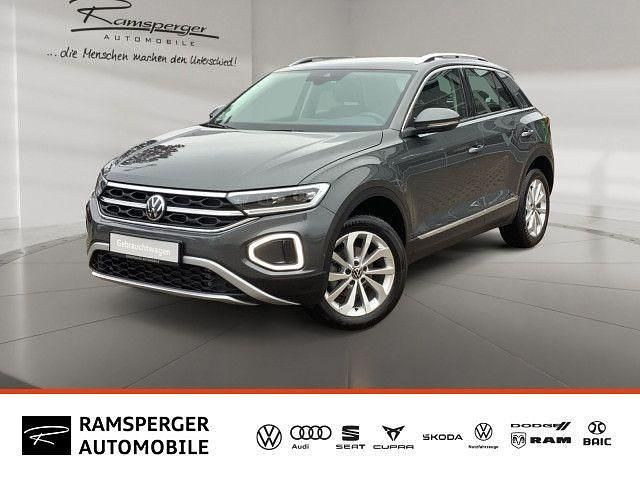Grau (indiumgrau metallic) Gebraucht 2024 VW T-Roc Style SUV | 30.990 € (Fairer Preis) - Bild 1/4