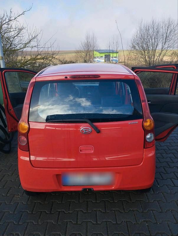 Gebraucht Daihatsu Cuore 65 PS (47 kW) 2008 Rot Kleinwagen