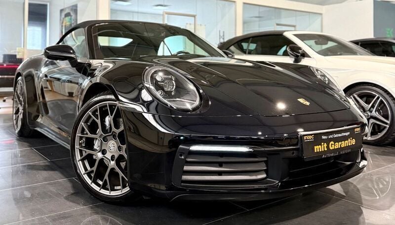 Tiefschwarzmetallic Gebraucht 2020 Porsche 911 Carrera Cabriolet Sport Cabrio | 107.999 € (Fairer Preis) - Bild 1/4