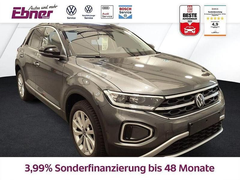 Indiumgrau metallic/schwarz Gebraucht 2024 VW T-Roc Style SUV | 29.880 € (Fairer Preis) - Bild 1/4