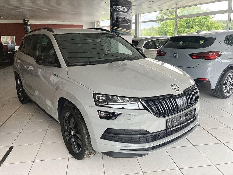 Steelgrau Gebraucht 2020 Skoda Karoq SportLine SUV | 26.795 € (Fairer Preis) - Bild 1/4