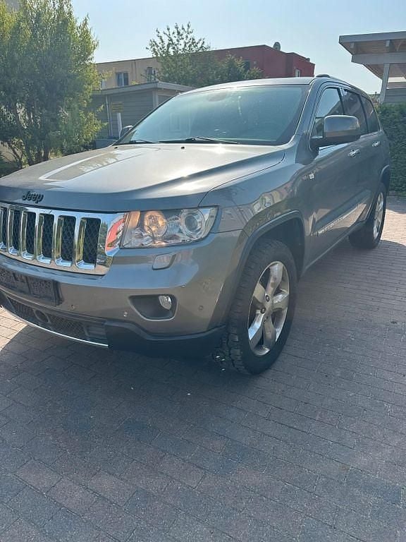 Grau Gebraucht 2013 Jeep Grand Cherokee Summit SUV | 7.500 € (Superpreis) - Bild 1/4