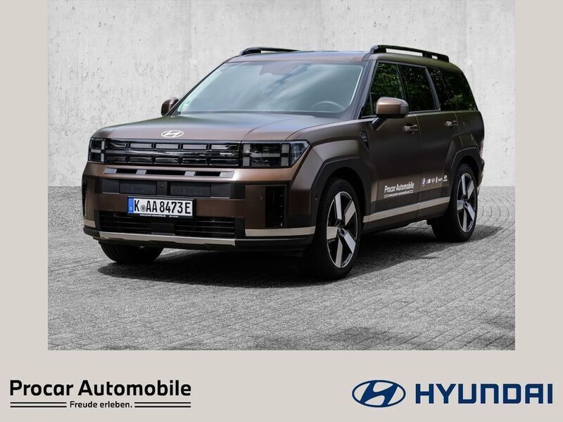 Earthy brass / mat Gebraucht 2025 Hyundai Santa Fe Signature SUV | 50.450 € - Bild 1/4
