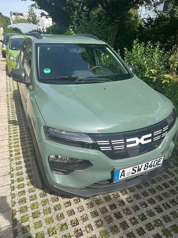 Grün Gebraucht 2023 Dacia Spring Essentiel Kleinwagen | 12.500 € (Fairer Preis) - Bild 1/4