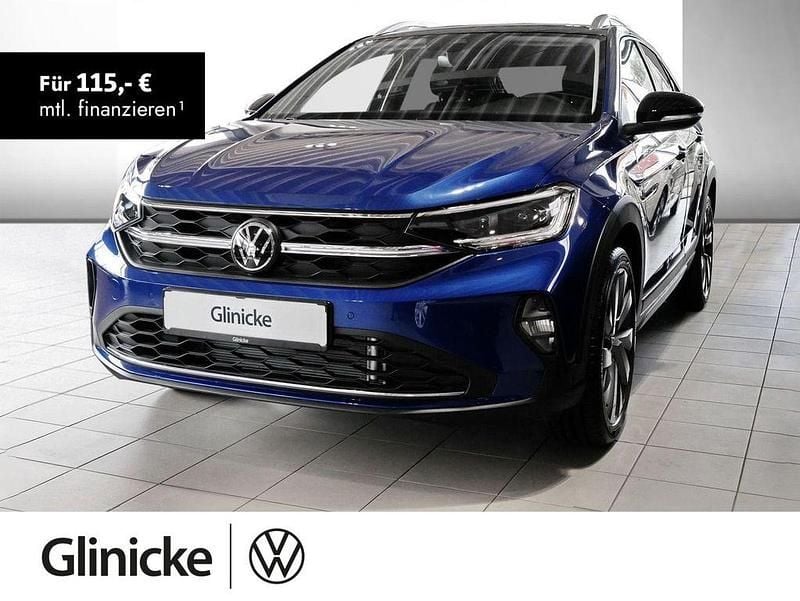 Reef blue metallic / schwarz Gebraucht 2024 VW Taigo Style SUV | 26.470 € (Fairer Preis) - Bild 1/3