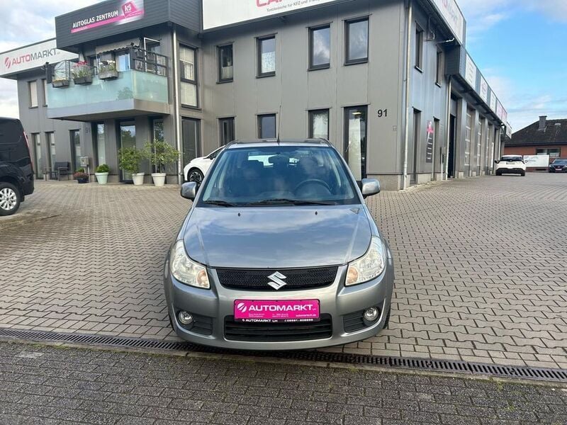 Grau Gebraucht 2007 Suzuki SX4 Comfort Limousine | 3.990 € (Teuer) - Bild 1/4