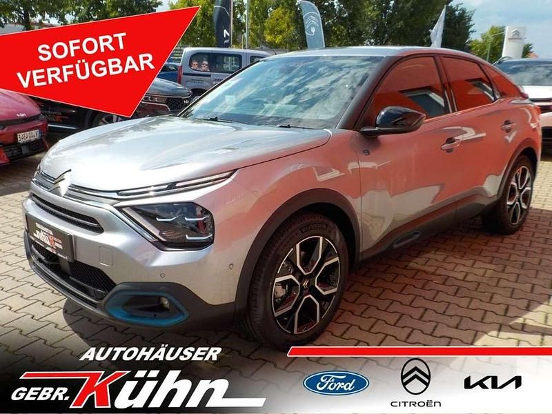 Grau Gebraucht 2024 Citroën e-C4 Shine Limousine | 27.900 € (Teuer) - Bild 1/4