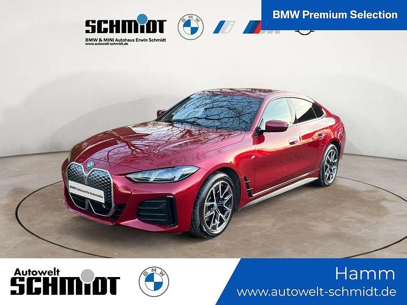 Fire red metallic Gebraucht 2024 BMW i4 M Sport Limousine | 45.287 € (Superpreis) - Bild 1/3