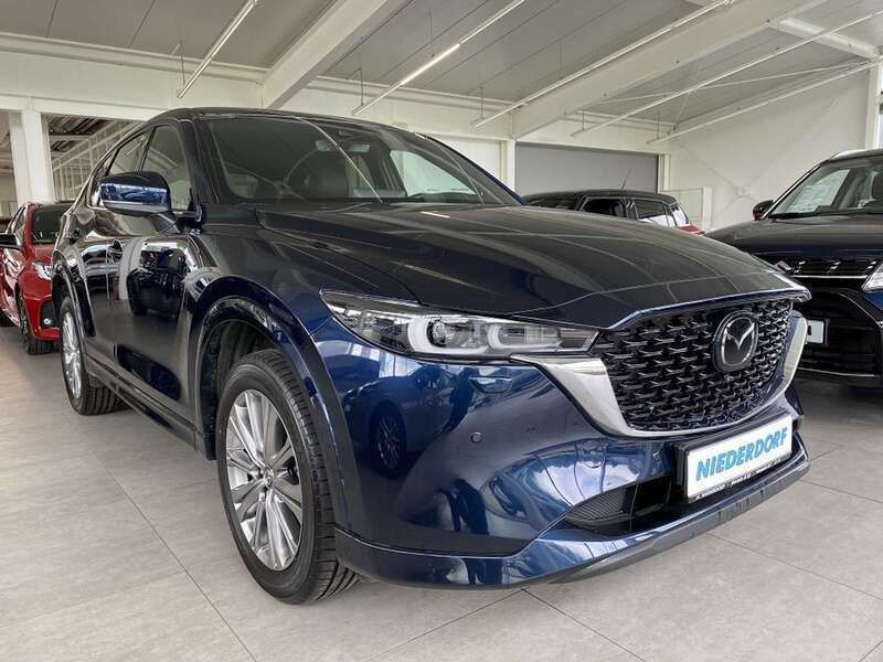 Deep crystal blue (metallic) Gebraucht 2023 Mazda CX-5 Takumi-Line SUV | 38.900 € (Fairer Preis) - Bild 1/4
