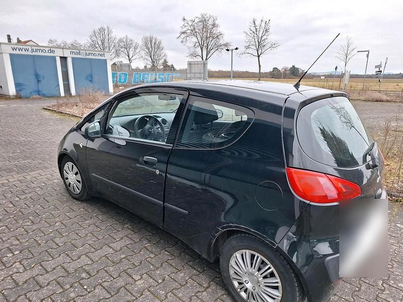 Second-hand Mitsubishi Colt 70 CP (51 kW) 2006 Negru Berlinǎ