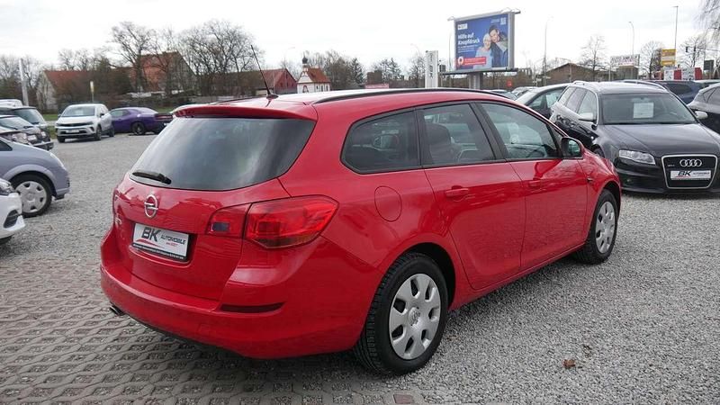 Gebraucht Opel Astra 120 PS (88 kW) 2011 Power rot/traffic red ral3020 Kombi
