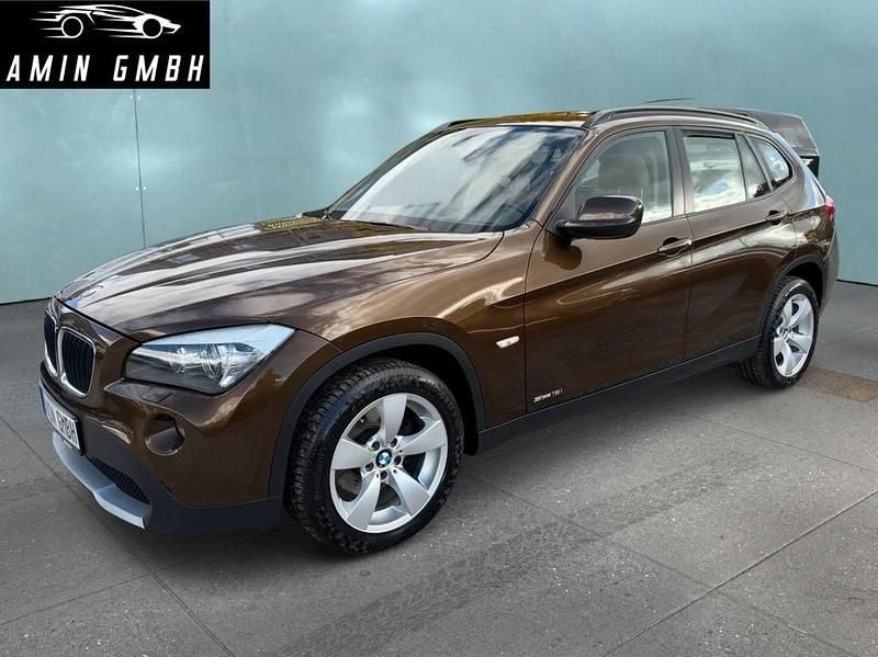 Braun Gebraucht 2011 BMW X1 Sport Line SUV | 8.999 € (Superpreis) - Bild 1/4