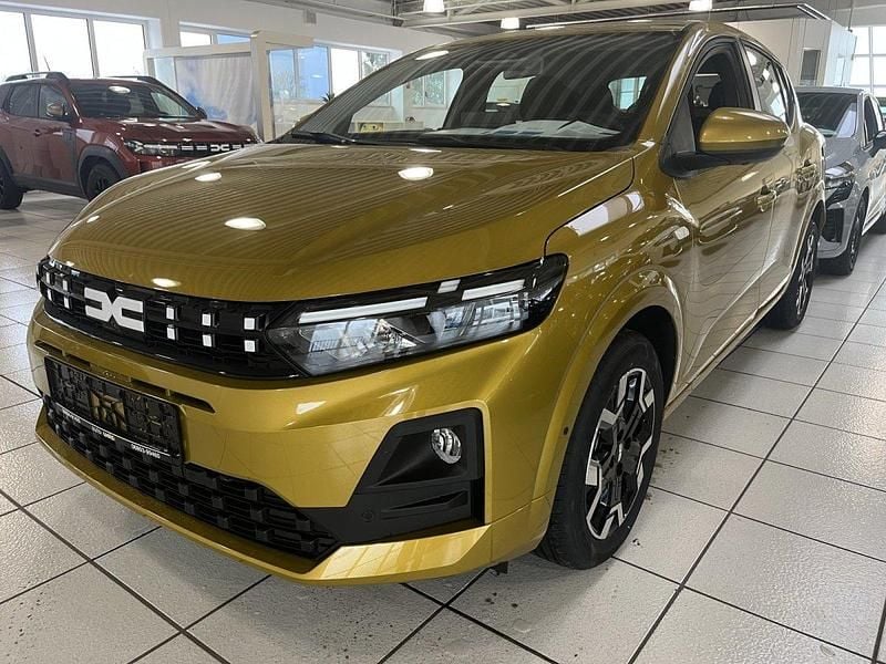 Neu Dacia Sandero Comfort 101 PS (74 kW) 2025 Amber yellow Limousine