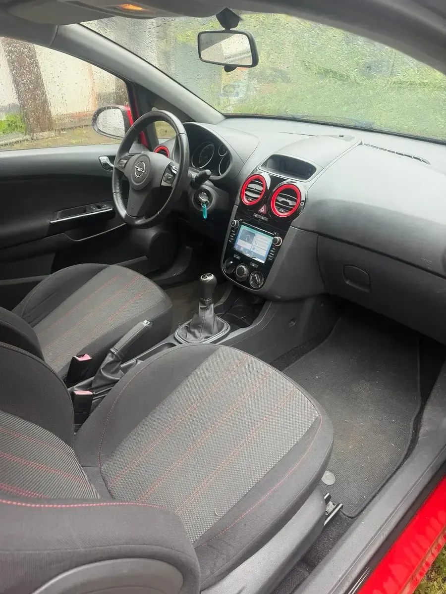 Usata Opel Corsa 101 CV (74 kW) 2011 Rosso Utilitaria