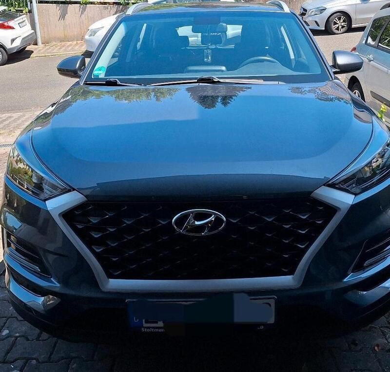 Grau Gebraucht 2019 Hyundai Tucson Classic SUV | 14.999 € (Superpreis) - Bild 1/4