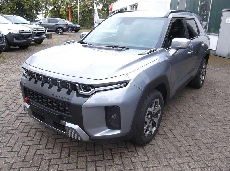Silber Neu 2024 Ssangyong Torres Quartz SUV | 32.990 € - Bild 1/4