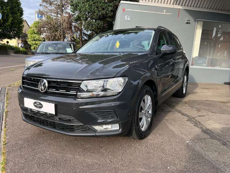 Uranograu Gebraucht 2017 VW Tiguan Sound SUV | 23.499 € (Fairer Preis) - Bild 1/4