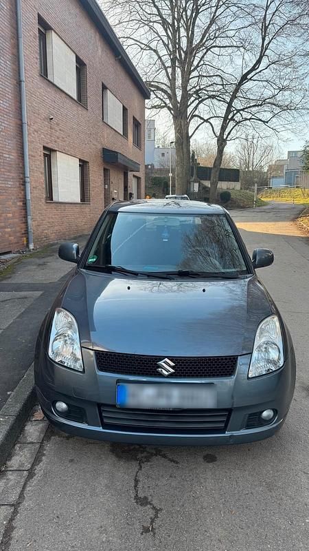 Grau Gebraucht 2007 Suzuki Swift Limousine | 3.500 € (Fairer Preis) - Bild 1/4