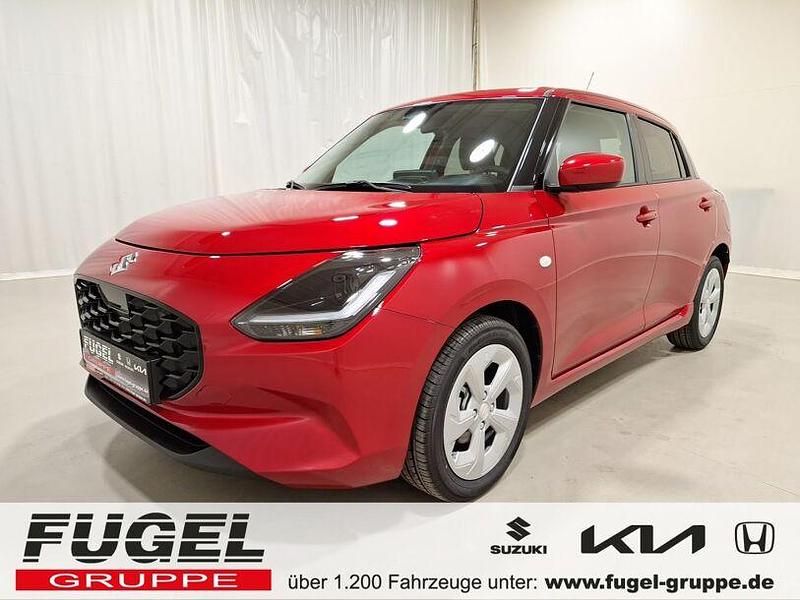 Burning red Neu 2024 Suzuki Swift Comfort Kleinwagen | 17.999 € - Bild 1/4