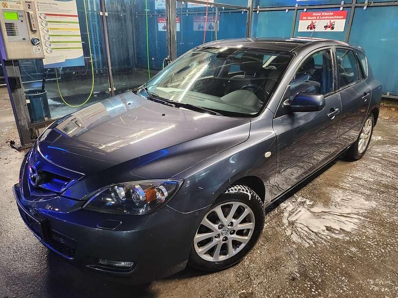 Kronosgrau metallic Gebraucht 2009 Mazda 3 Active Kleinwagen | 3.599 € (Fairer Preis) - Bild 1/4