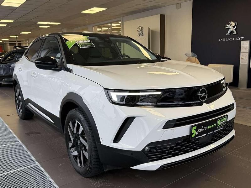 Gebraucht Opel Mokka-e Elegance 100 kW (136 PS) 2023 Lack weiss banquise/typ aussen SUV