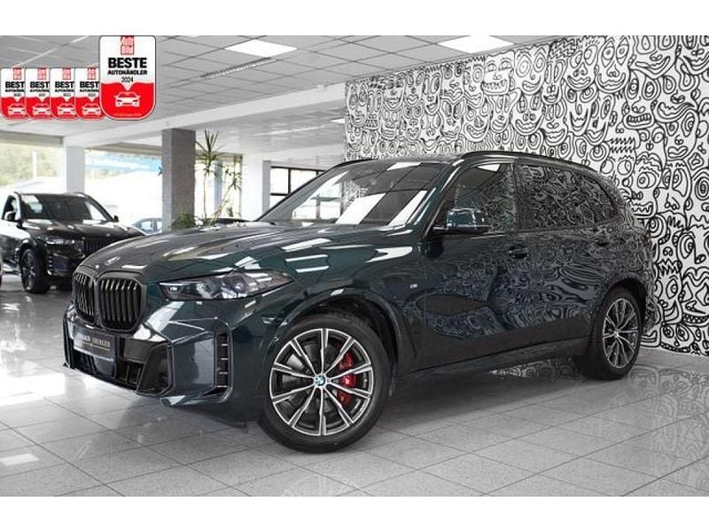 Individual oxfordgrün 2 (metallic) Gebraucht 2024 BMW X5 M M Sport SUV | 89.900 € (Guter Preis) - Bild 1/3