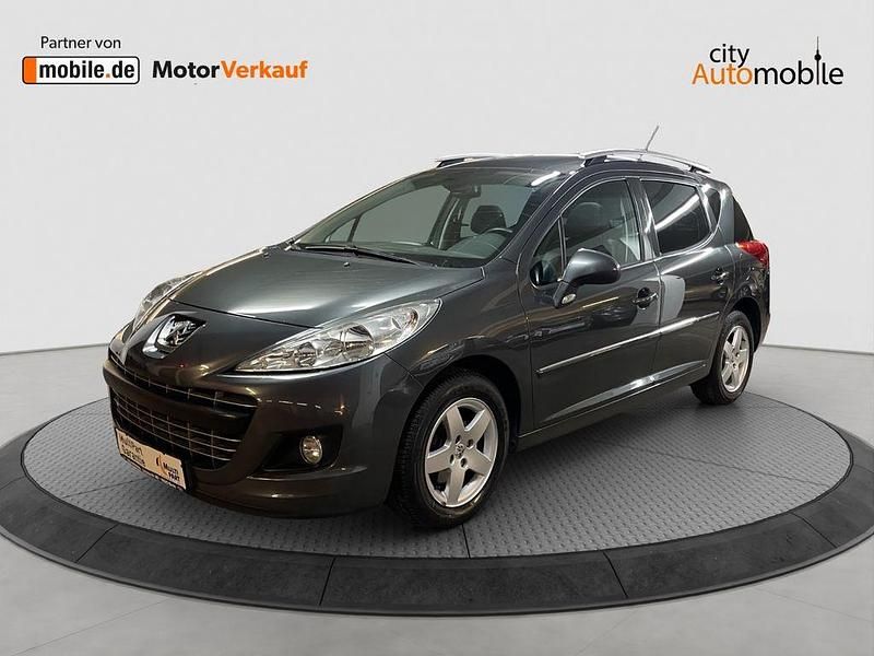Grau (metallic) Gebraucht 2012 Peugeot 207 Premium Kombi | 6.300 € (Teuer) - Bild 1/4