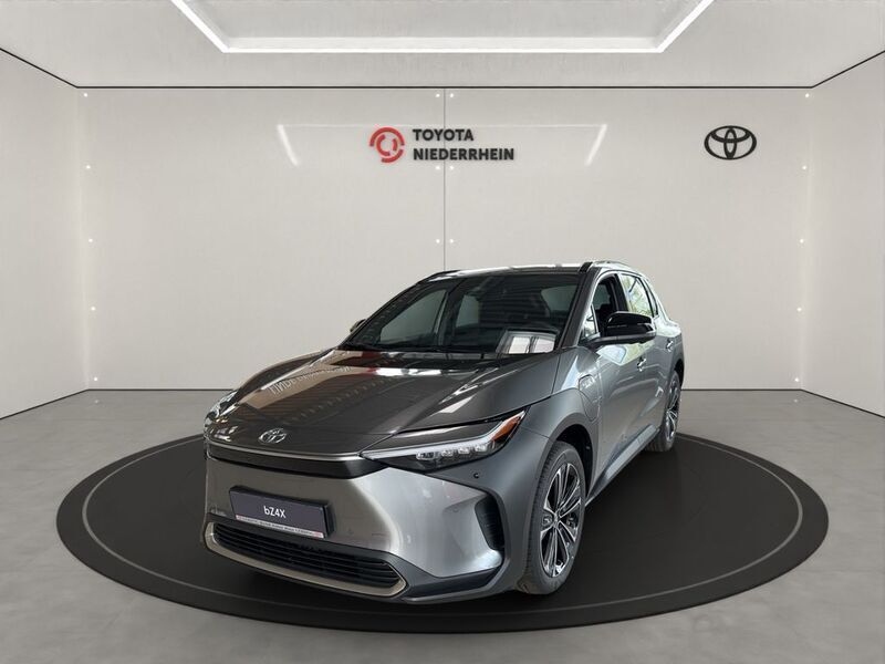 Grau Gebraucht 2023 Toyota bZ4X Comfort SUV | 40.444 € (Teuer) - Bild 1/4