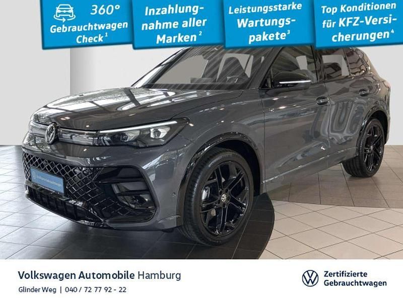 Delfingrau metallic Gebraucht 2024 VW Tiguan R-line SUV | 48.990 € - Bild 1/3