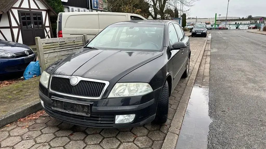 Używany Skoda Octavia Elegance 105 KM (77 kW) 2004 Czarny Sedan/Limuzyna