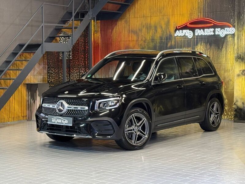 Kosmosschwarz metalliclack Gebraucht 2021 Mercedes GLB200 AMG line SUV | 32.900 € (Fairer Preis) - Bild 1/4