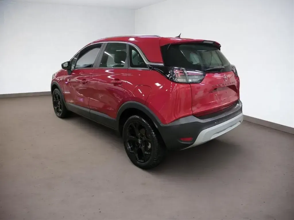 Gebraucht Opel Crossland X Elegance 110 PS (80 kW) 2023 Lackierung peperoncino red/metal (metallic) SUV