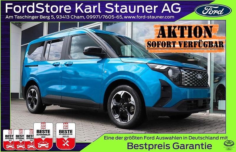 Digital aqua blue metallic Neu 2025 Ford Tourneo Titanium Van / Kleinbus | 27.980 € - Bild 1/4