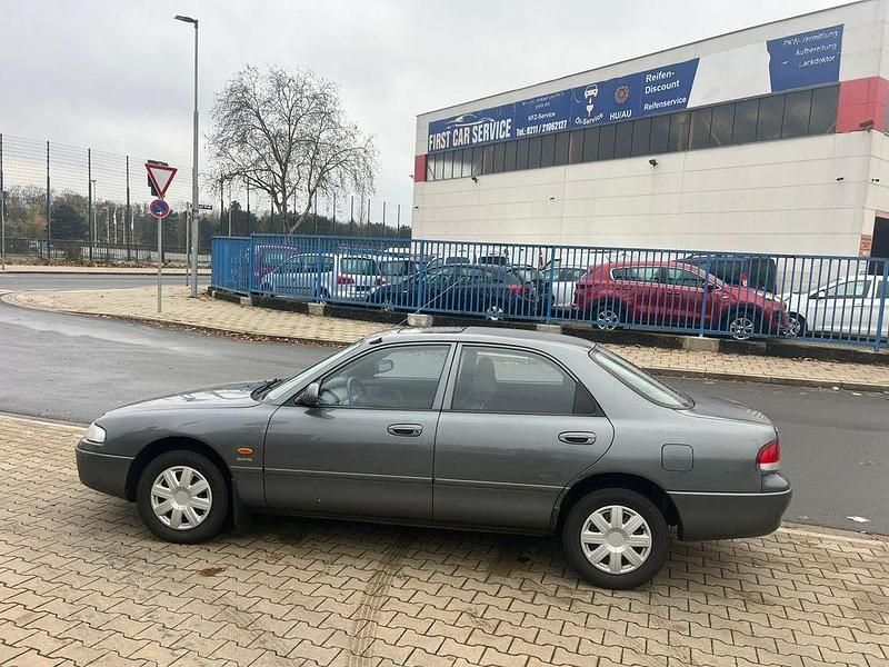 Grau Gebraucht 1995 Mazda 626 Limousine | 2.499 € - Bild 1/4