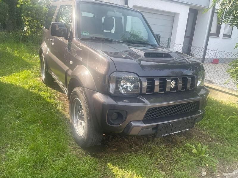 Grau Gebraucht 2015 Suzuki Jimny Ranger Style SUV | 11.990 € (Etwas zu teuer) - Bild 1/4