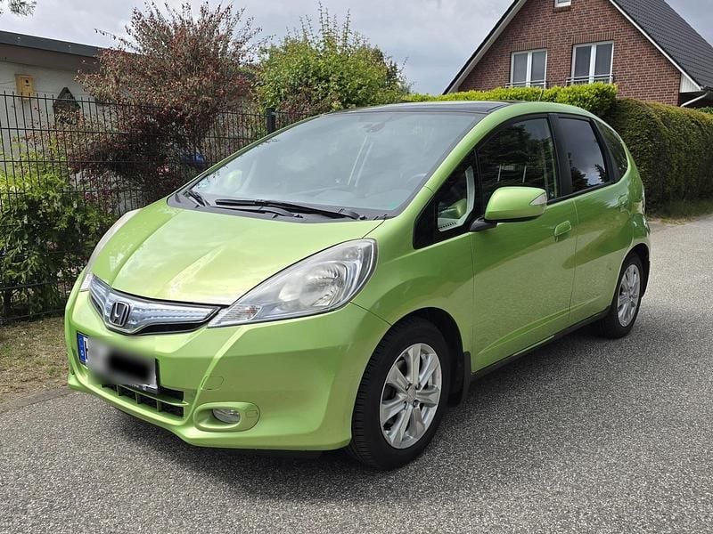 Grün Gebraucht 2013 Honda Jazz Hybrid Kleinwagen | 3.990 € - Bild 1/4