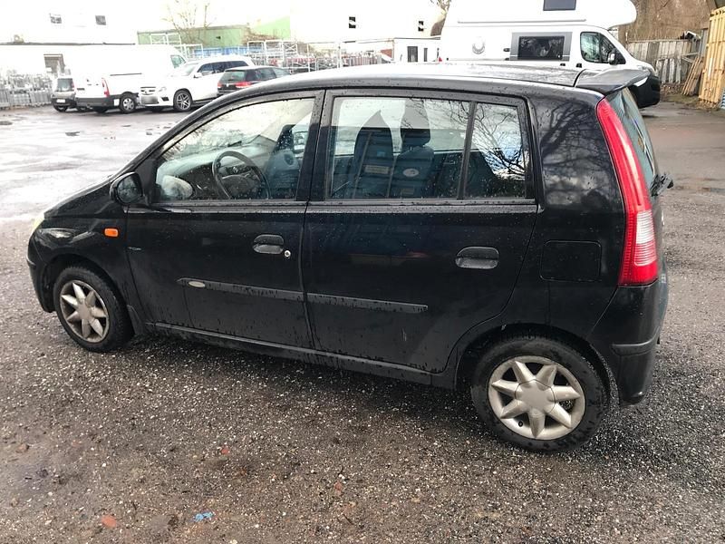 Gebraucht Daihatsu Cuore 58 PS (42 kW) 2004 Schwarz Kleinwagen