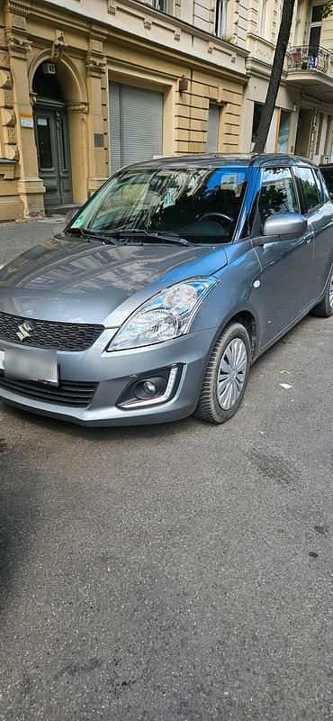 Grau Gebraucht 2015 Suzuki Swift Kleinwagen | 5.800 € (Fairer Preis) - Bild 1/4