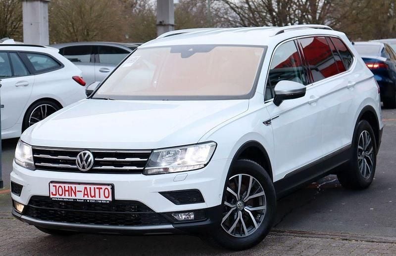 Pure white (metallic) Gebraucht 2018 VW Tiguan Allspace Comfortline SUV | 19.900 € (Superpreis) - Bild 1/4