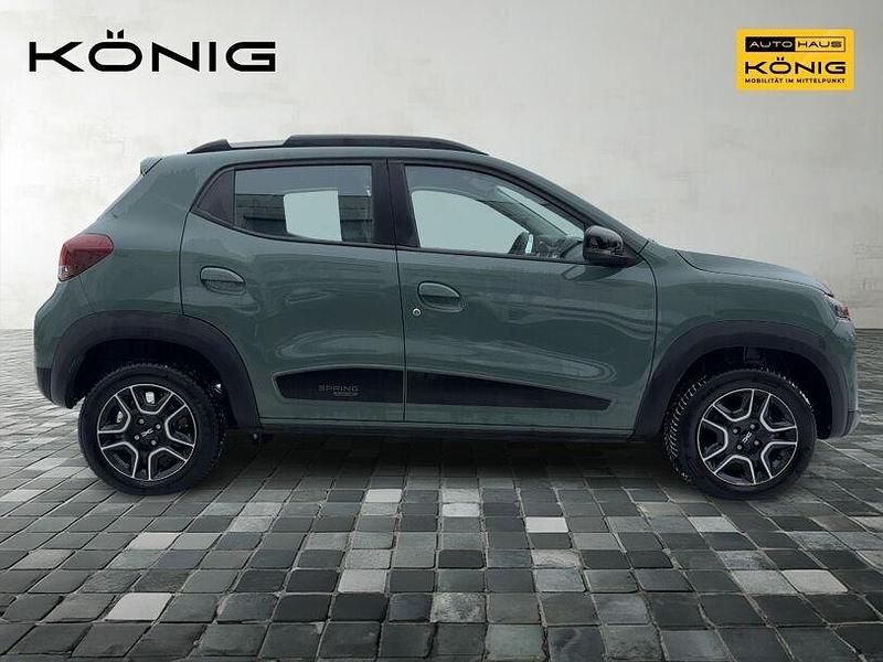 Gebraucht Dacia Spring Comfort 47 kW (65 PS) 2023 Olivgrün Kleinwagen