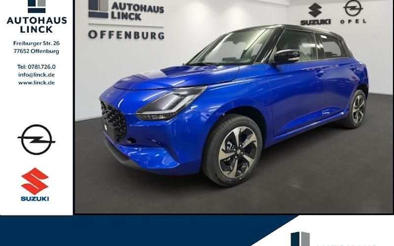 Blau Neu 2024 Suzuki Swift Comfort+ Limousine | 19.288 € - Bild 1/4